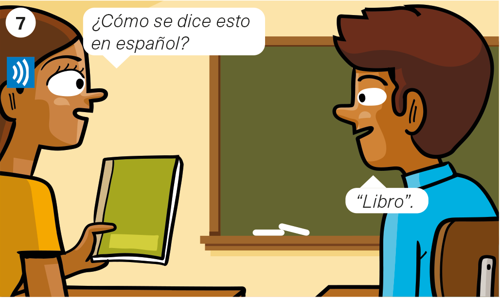 2 students in the classroom. Student A is holding a book: <es>¿Cómo se dice esto en español? </es> Student B: <es>Libro. </es>