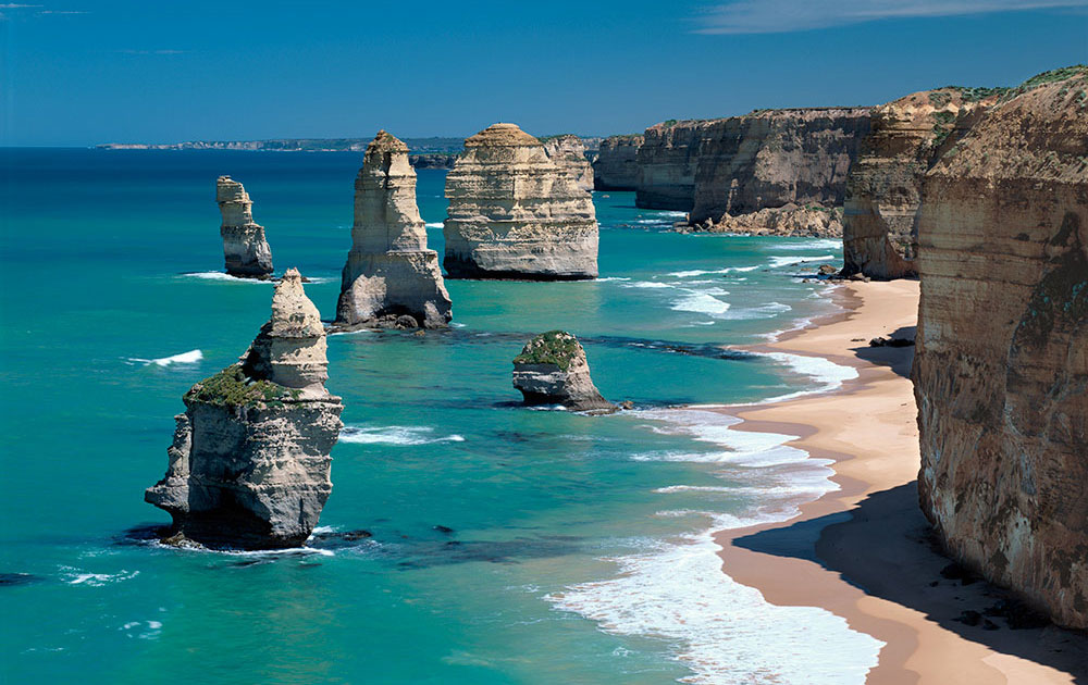 cliffs juting out into the green sea